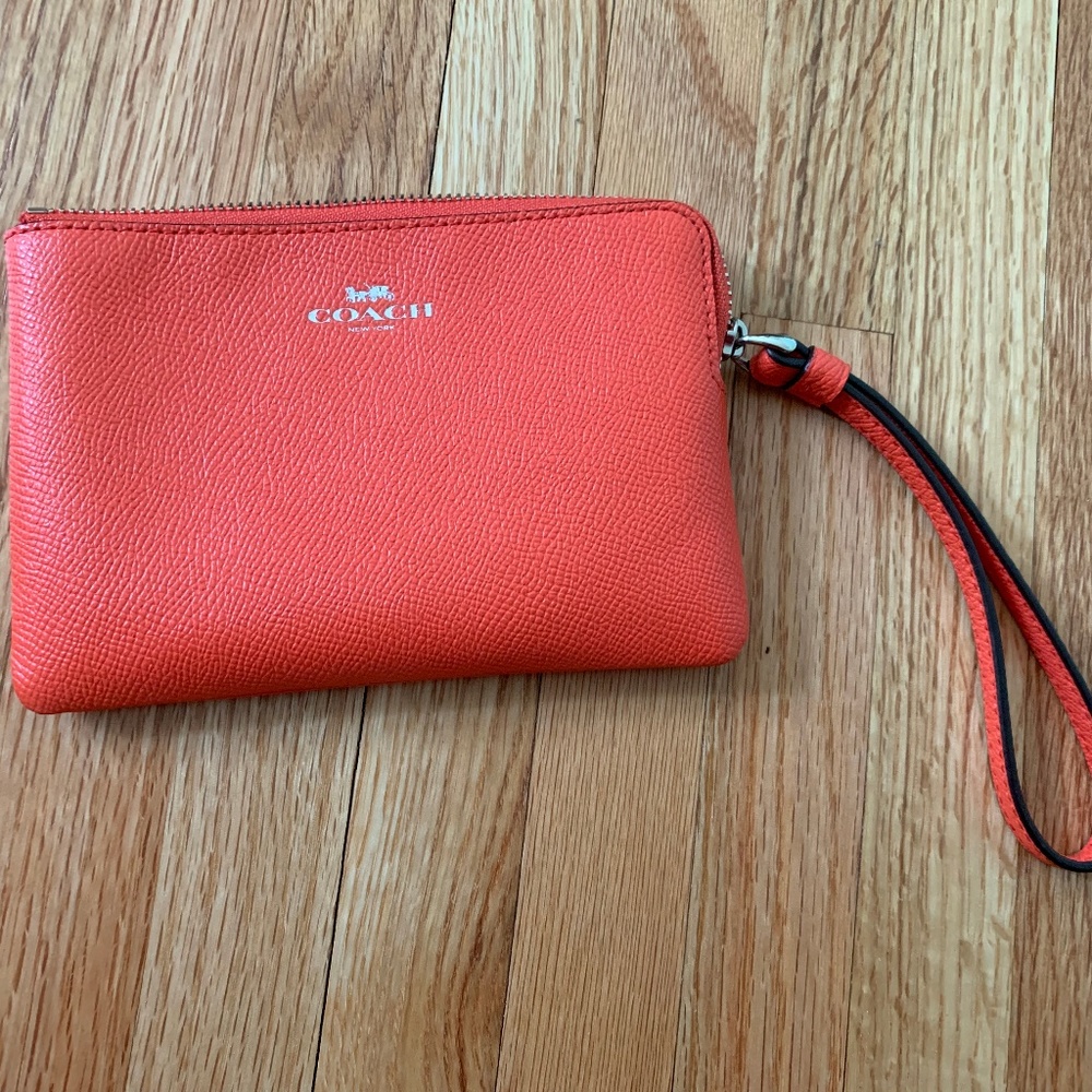 Orange Coach Leather Mini wristlet/ coin purse.